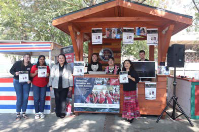 people standing at the president's booth