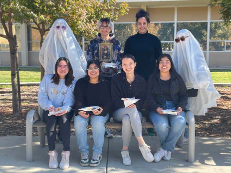 students sitting on a bench