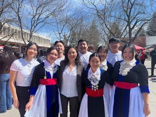students standing with the vice president