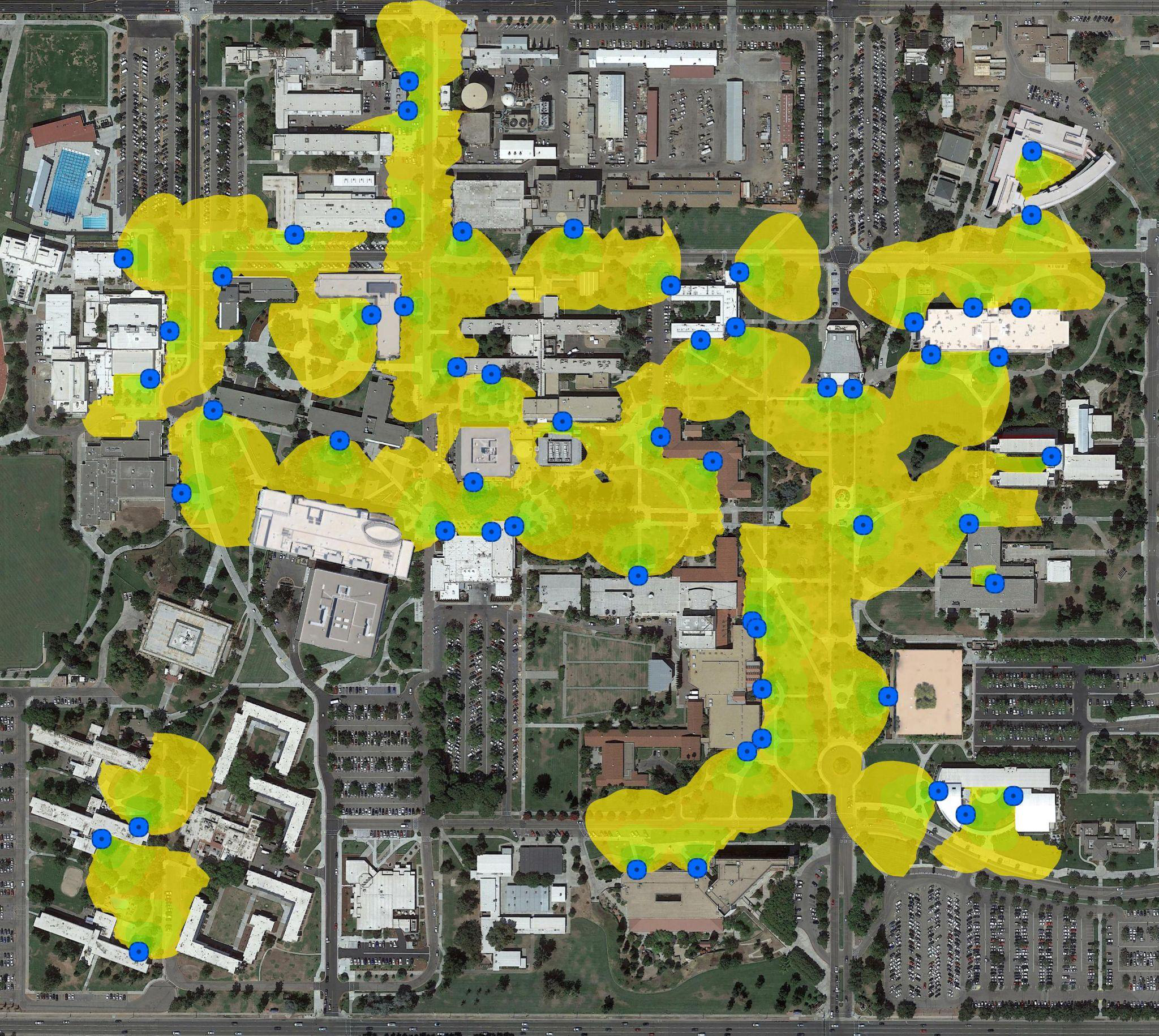 Campus aerial map showing outdoor wireless coverage areas highlighted in yellow with blue location markers