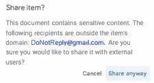 Google sharing dialog warning that the document contains sensitive content and the recipient is outside the domain