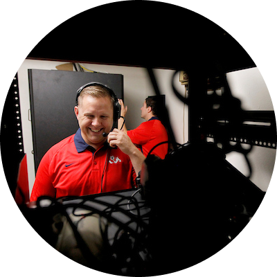 two fresno state staff working on hardware and on the phone